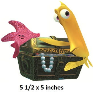 Toy shark and starfish with a treasure chest on a white background