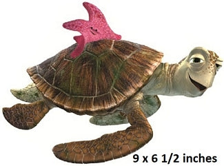 Toy turtle with pink shell on a white background